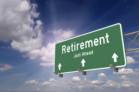 Large highway sign that reads retirement just ahead